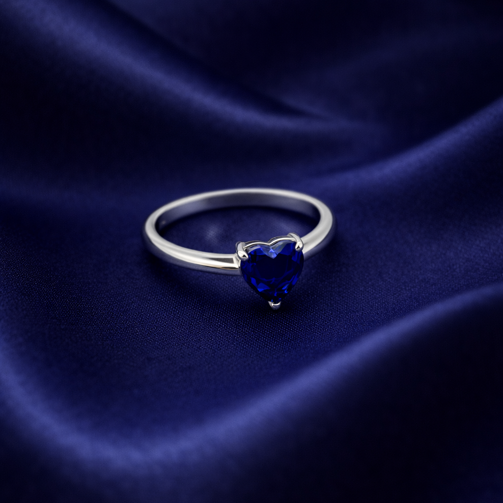 Elegant Silver Heart-Shaped Deep Blue Sapphire Solitaire Ring
