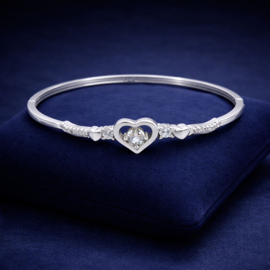 Elegant Silver Heart Bangle with Sparkling Gemstones