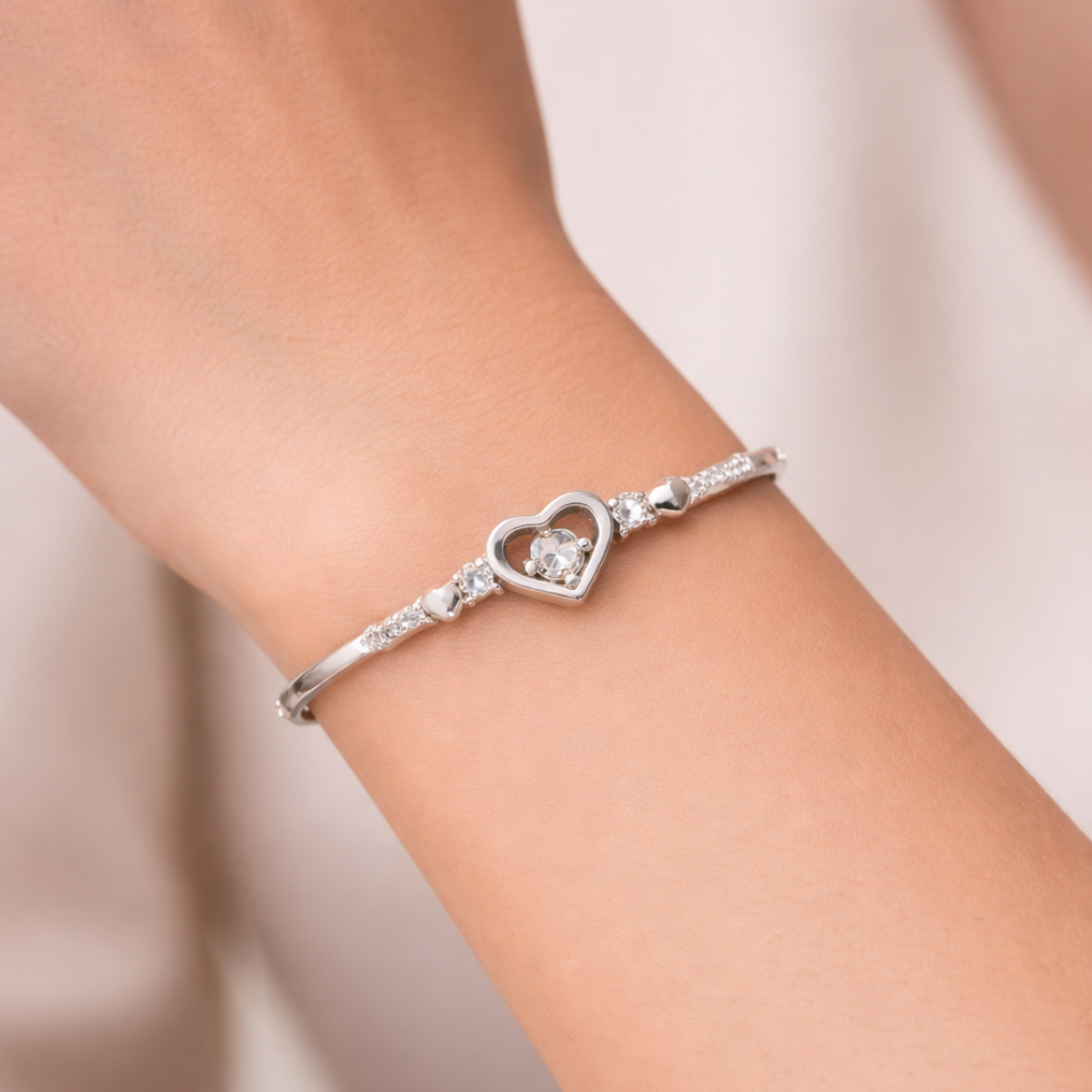 Elegant Silver Heart Bangle with Sparkling Gemstones