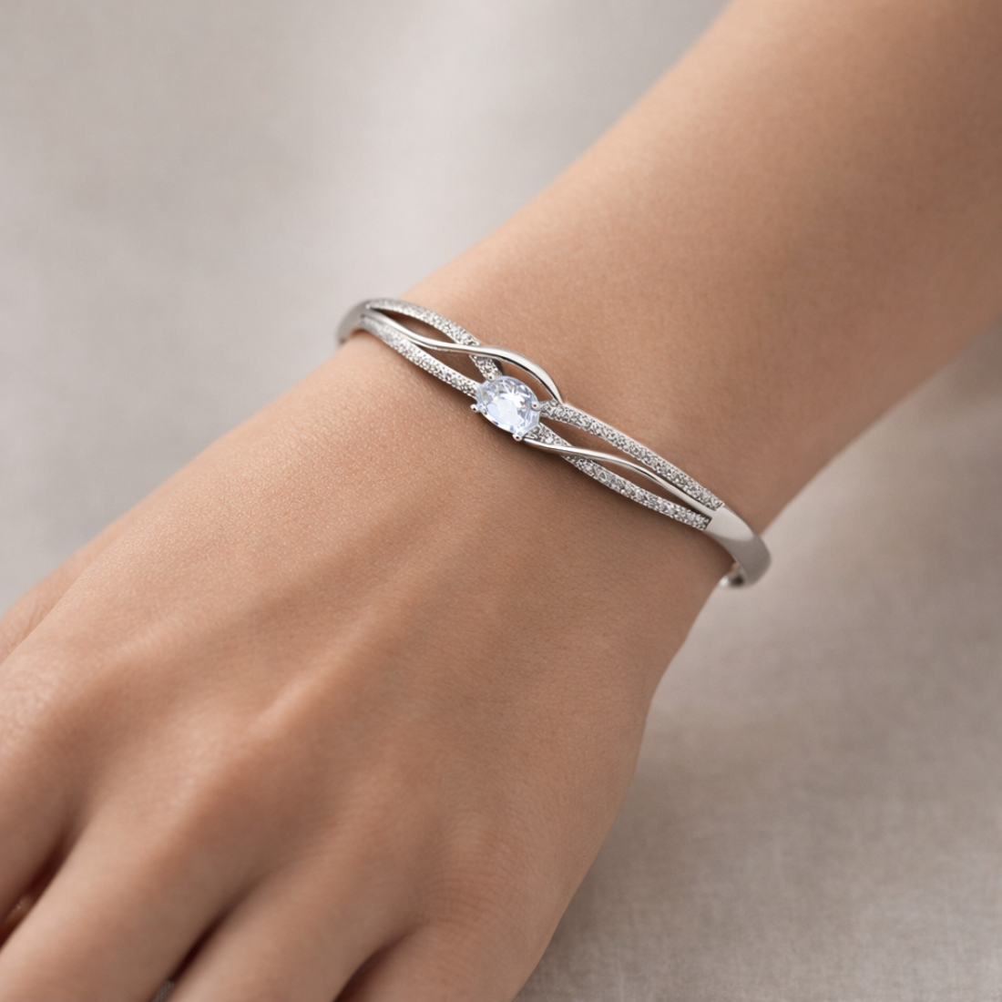 Elegant Silver Infinity Knot Solitaire Bangle