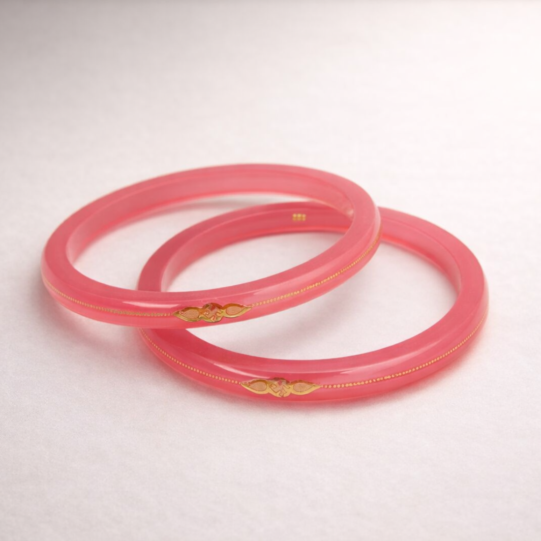 Elegant Pink Bangles with Gold Accents