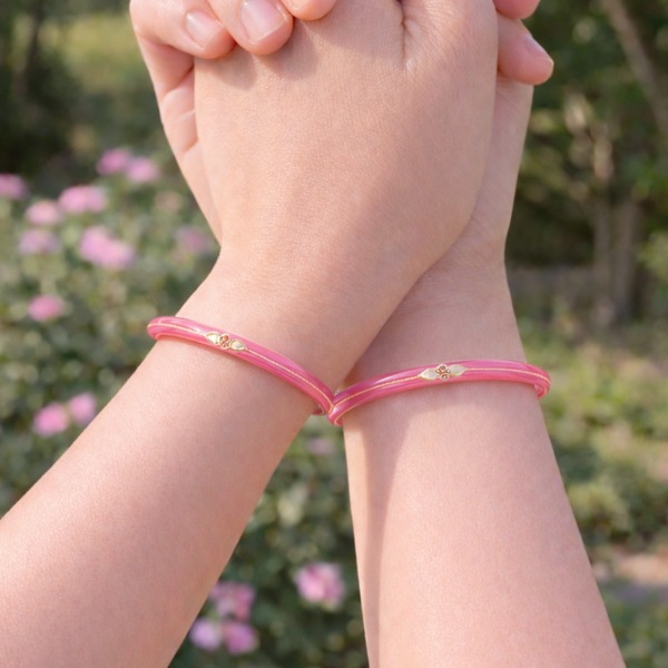 Elegant Pink Bangles with Gold Accents
