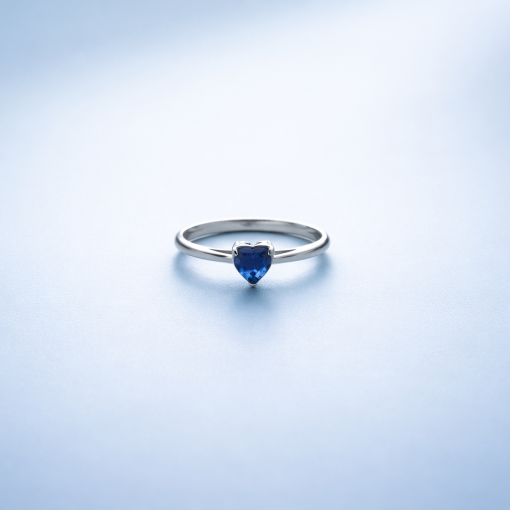 Elegant Silver Heart-Shaped Deep Blue Sapphire Solitaire Ring