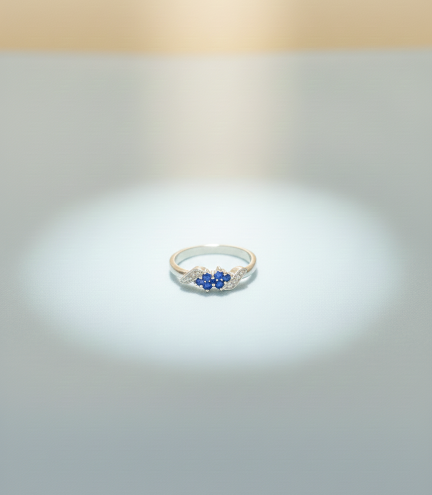 Elegant Three-Stone Blue Gemstone Ring with Diamond Accents