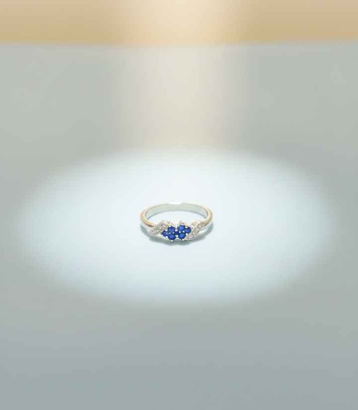 Elegant Three-Stone Blue Gemstone Ring with Diamond Accents