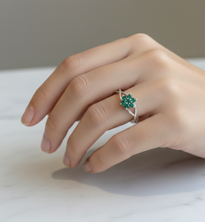 Silver Flower Ring with Braided Band and Green Gemstones
