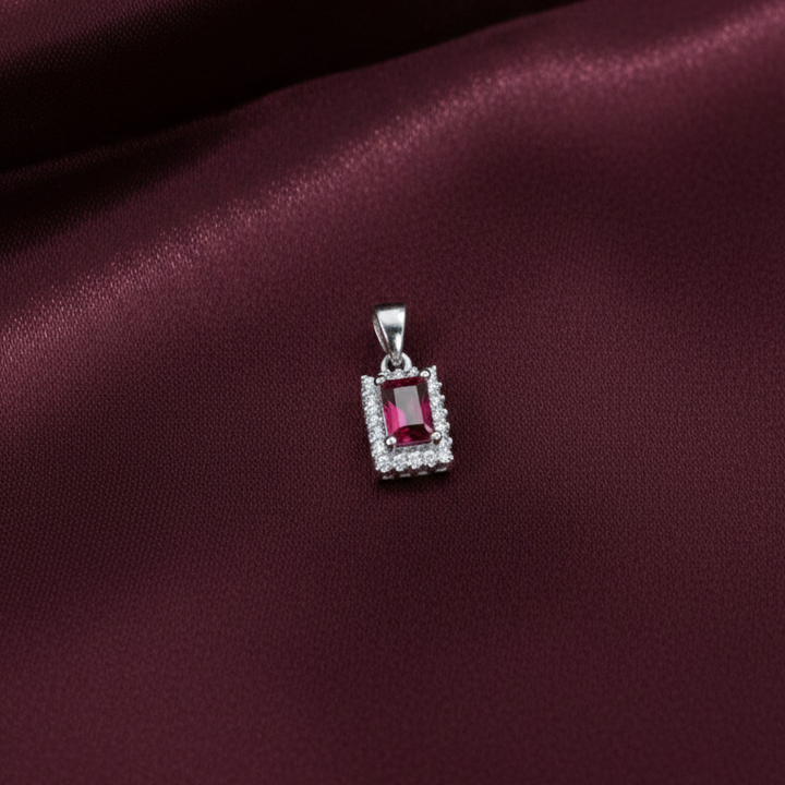 Emerald-Cut Crimson Ruby Halo Pendant in Sterling Silver