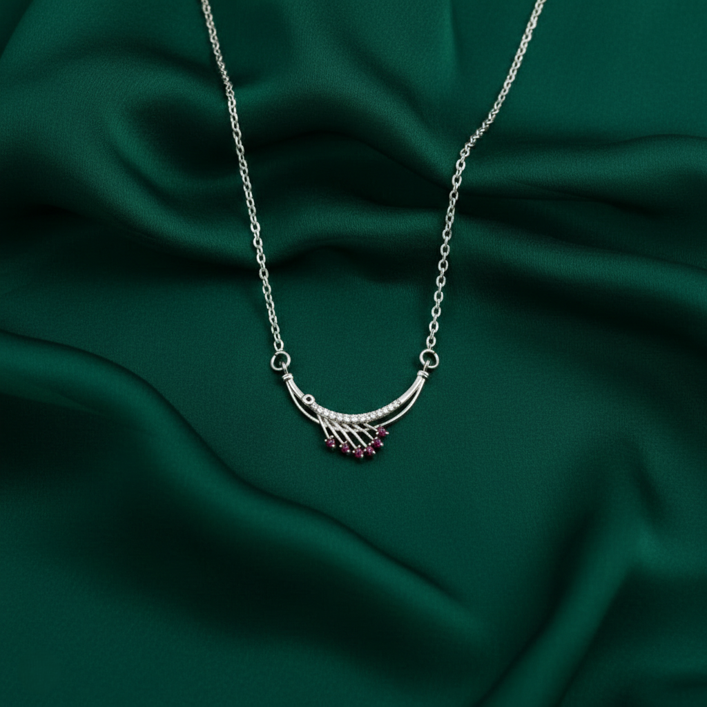 Timeless Elegance: Silver Finish Ruby-Toned Arc Pendant Necklace