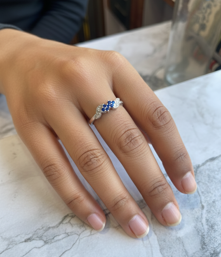 Elegant Three-Stone Blue Gemstone Ring with Diamond Accents