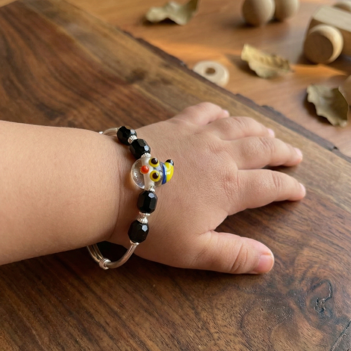 Adjustable Sterling Silver Baby Kada with Whimsical Glass and Black Agate Beads.
