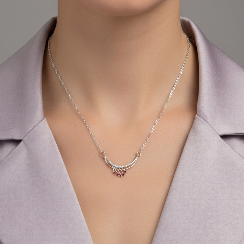 Timeless Elegance: Silver Finish Ruby-Toned Arc Pendant Necklace