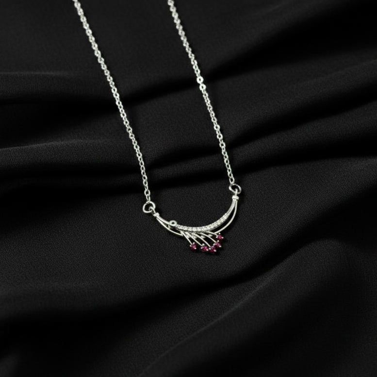 Timeless Elegance: Silver Finish Ruby-Toned Arc Pendant Necklace