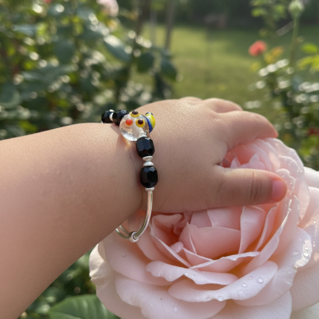 Adjustable Sterling Silver Baby Kada with Whimsical Glass and Black Agate Beads.