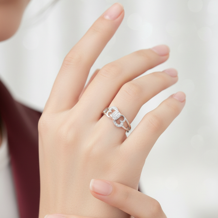 Elegant Silver Heart-Shaped Infinity Ring with Baguette-Cut Centerpiece