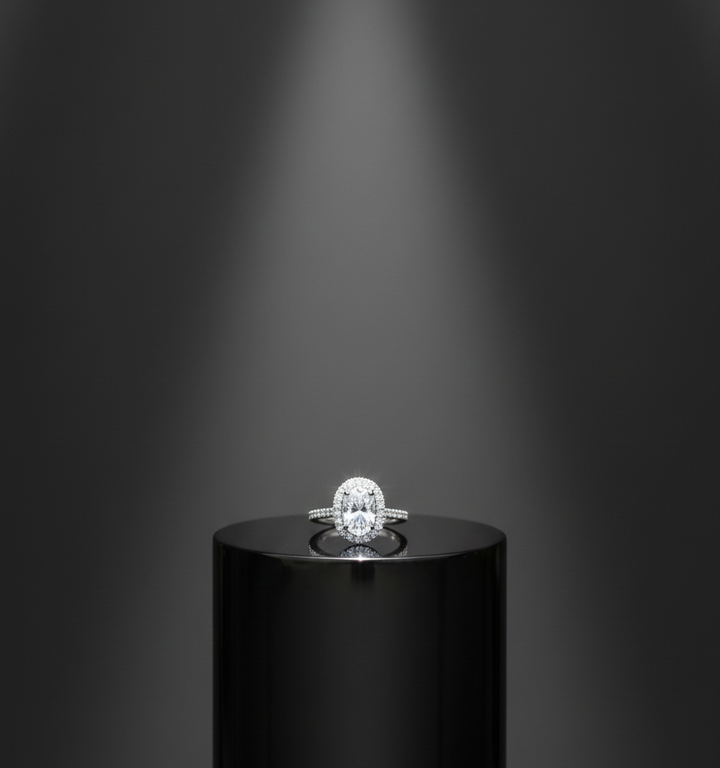 Dazzling Oval Diamond Halo Engagement Ring on a Black Pedestal