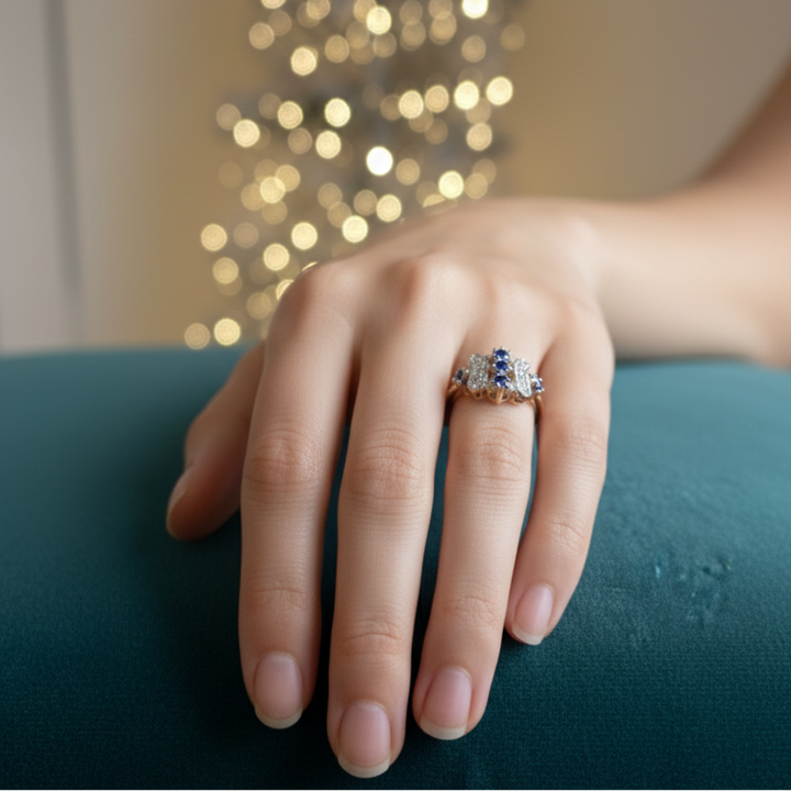 Vintage-Inspired Silver Ring with Ornate Blue Gemstone and Diamond Accents.