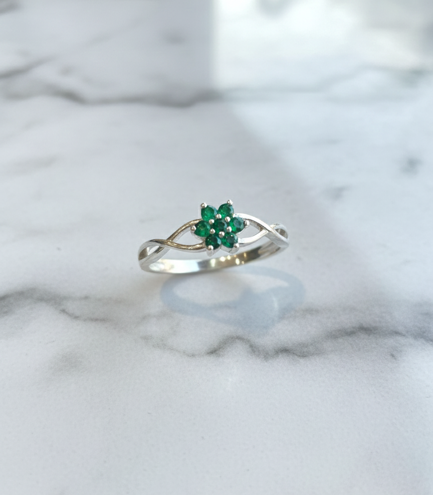 Silver Flower Ring with Braided Band and Green Gemstones