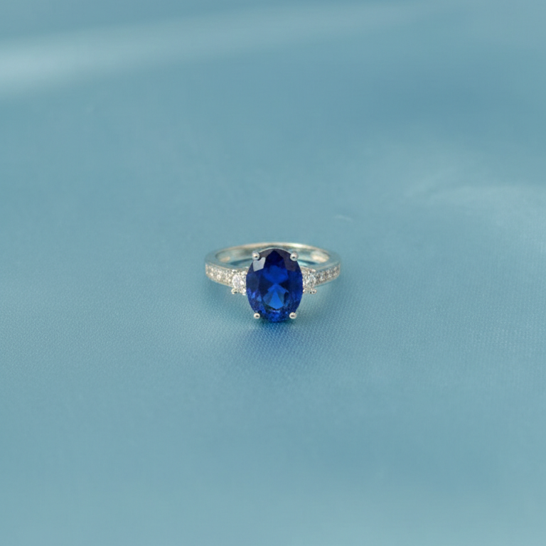 Silver Oval Blue Sapphire Ring with Sparkling Zirconia Accents
