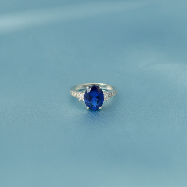 Silver Oval Blue Sapphire Ring with Sparkling Zirconia Accents