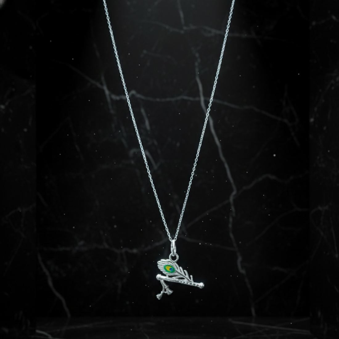Symbolic Silver Flute and Peacock Feather Pendant.